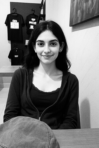 A_digital_photograph_features_a_young_woman_in_her
